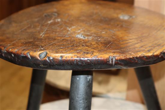 An 18th century elm primitive stool W.40cm at base